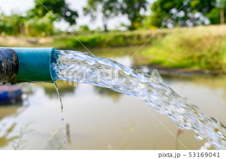 Agriculture blue pipe with groundwater gushing Agriculture blue pipe with groundwater gushing 53169041
