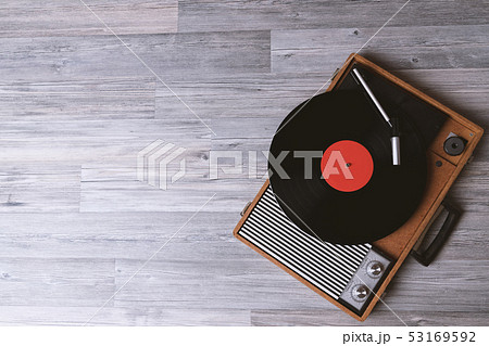 Older turntable with a vinyl record 53169592