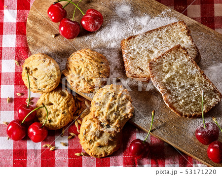 Oatmeal cookies snack and cherry breakfast close up Oatmeal cookies snack and cherry breakfast close up 53171220