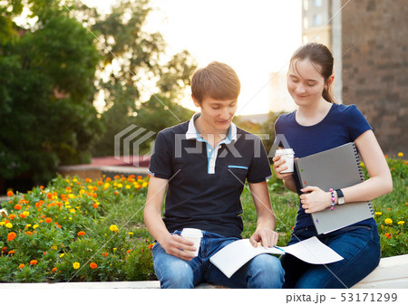 Couple of college students during a brake between 53171299