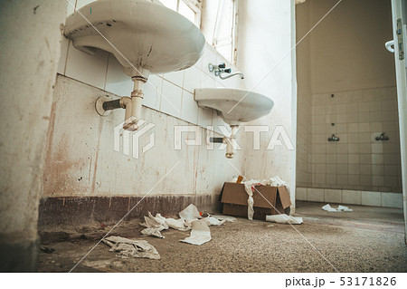 old dirty toilet in abandoned psychiatric hospital 53171826