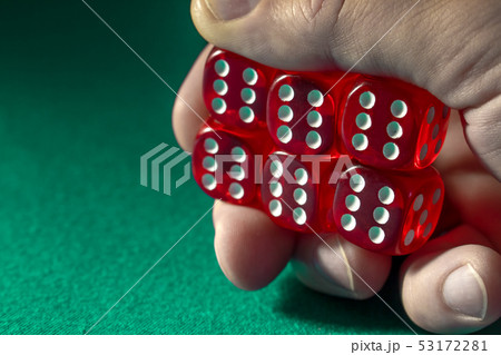 Closeup of hand holding red dice with a winning Closeup of hand holding red dice with a winning 53172281