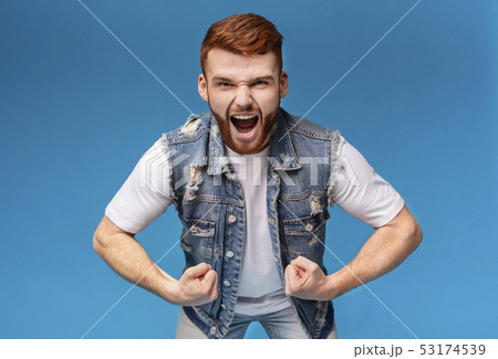 Young angry muscular man screaming loud at camera 53174539