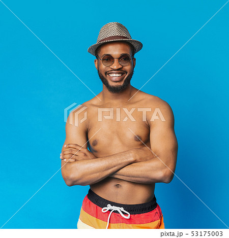 Confident shirtless black guy smiling at camera with crossed arms Confident shirtless black guy smiling at camera with crossed arms 53175003