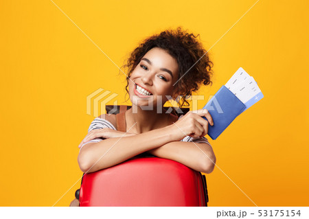 Afro Woman With Tickets Looking At Camera 53175154