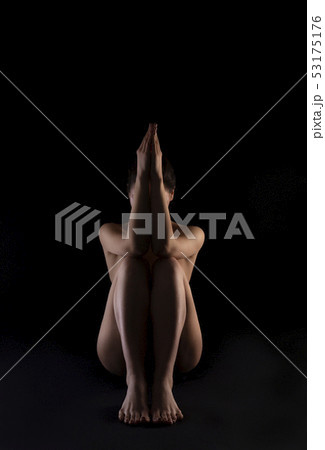 Body silhouette of naked woman, sitting on black background. Body silhouette of naked woman, sitting on black background. 53175176