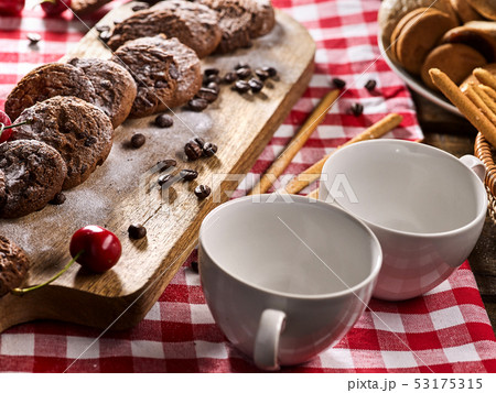 Oatmeal chocolate cookies with coffee grains and cherry. Sun flare 53175315