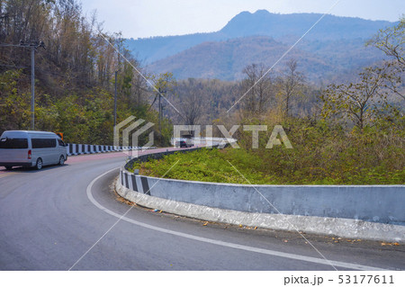 Van on the road down hill with travel 53177611