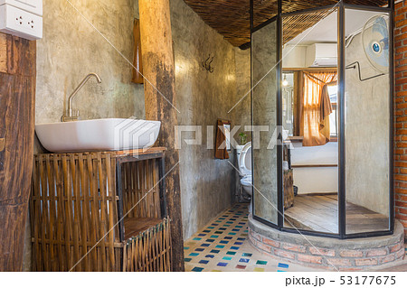 Sink and Faucet in Toilet of Country Loft Interior 53177675