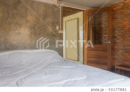 White Bed in Bedroom in Country Loft Interior White Bed in Bedroom in Country Loft Interior 53177681