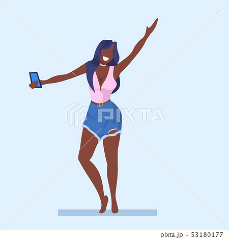 casual woman taking selfie photo on smartphone camera young african american girl raising hand casual woman taking selfie photo on smartphone camera young african american girl raising hand 53180177