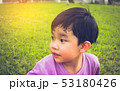 boy looking on left side in park. 53180426