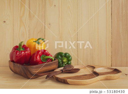 sweet peppers on wooden table background 53180430