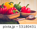 sweet peppers on wooden table background 53180431
