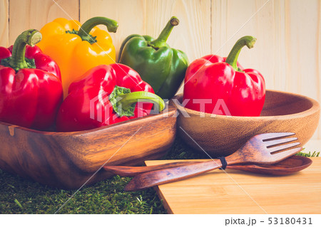 sweet peppers on wooden table background 53180431