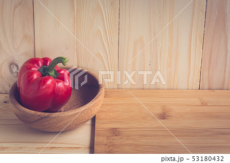 sweet peppers on wooden table background 53180432