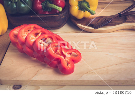 sweet peppers on wooden table background 53180710