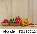 sweet peppers on wooden table background 53180712