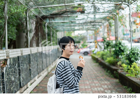 woman eat traditional Taiwanese snack woman eat traditional Taiwanese snack 53183666