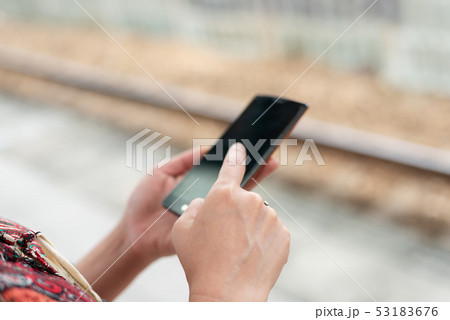 mature traveling woman waiting and using a 53183676