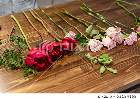set of flowers for a bouquet on the table. The job of a florist. Master class on making bouquets 53184168