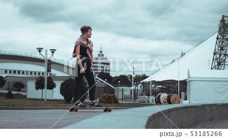 Young sporty woman riding on the longboard 53185266