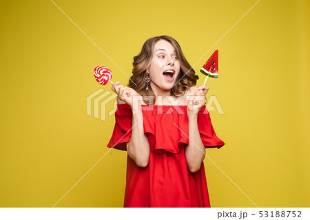 Seductive woman like sweet doll with candy. Seductive woman like sweet doll with candy. 53188752
