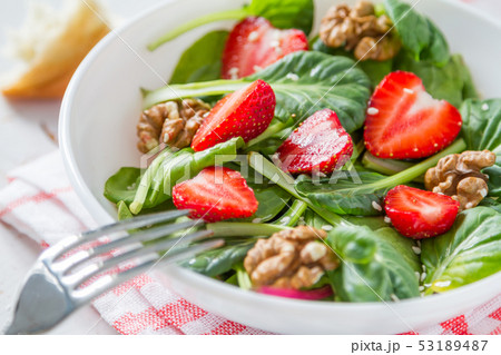 Strawberry salad in white bowl 53189487