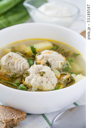 Sorrel soup in white bowl 53189587