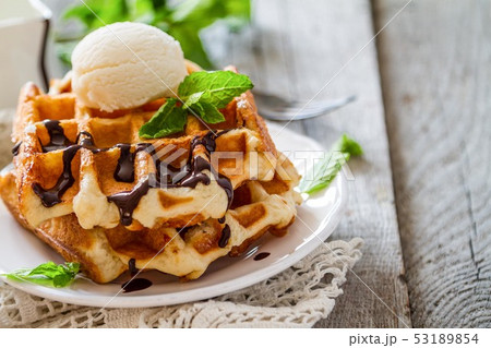 Waffles with banana and nuts honey Waffles with banana and nuts honey 53189854