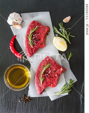 Raw meat on wood background Raw meat on wood background 53190088