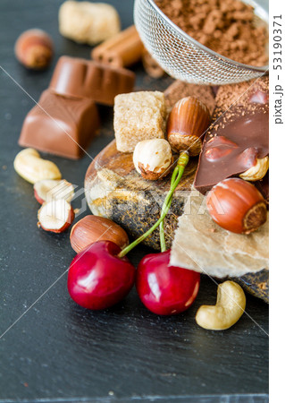 Selection of chocolate and nuts, copy space Selection of chocolate and nuts, copy space 53190371