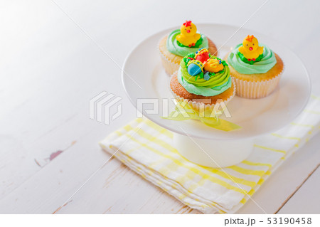 Easter cupcakes on white wood background Easter cupcakes on white wood background 53190458
