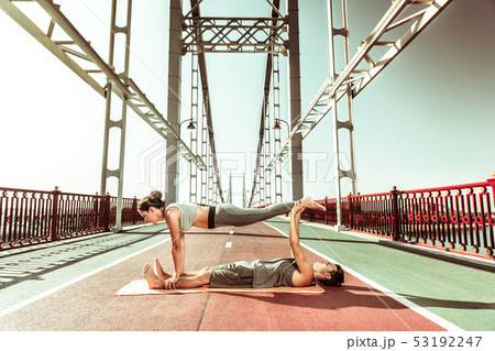 Active young people stretching and doing yoga asanas 53192247