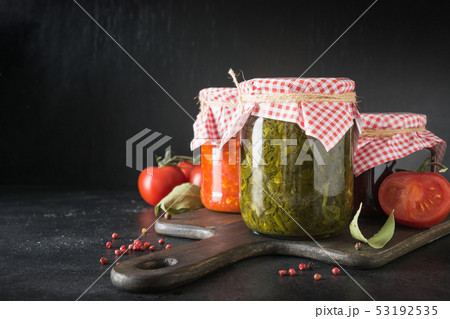Various types of canned sauce for serving to meat. 53192535