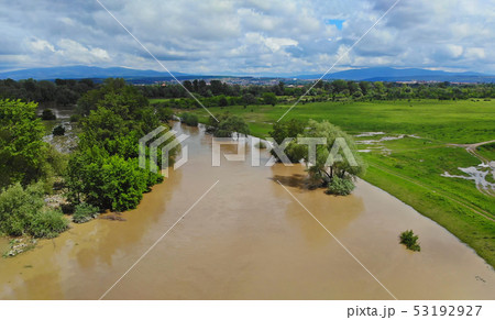 Rural village along river water at high levels Rural village along river water at high levels 53192927