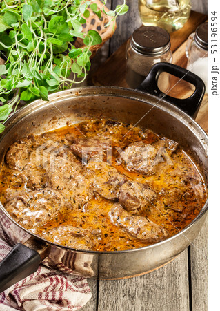Pork tenderloin in mushroom sauce 53196594