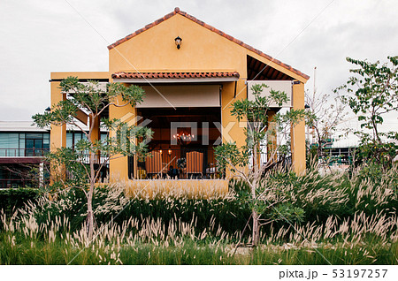Colourful Mediterranean style building in grass Colourful Mediterranean style building in grass 53197257
