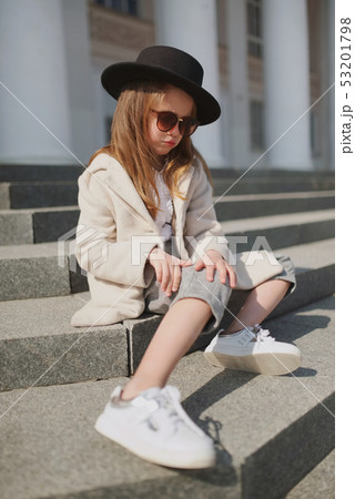 little girl portrait on the street 53201798