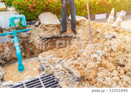 worker repair pipe plumbing water main broken worker repair pipe plumbing water main broken 53201840