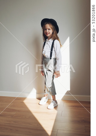 cute little girl with black hat at home cute little girl with black hat at home 53201866