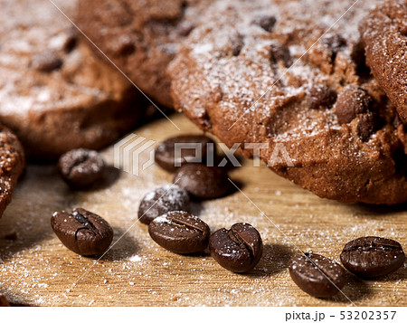 Oatmeal chocolate cookies with coffee grains and cherry. Sun flare Oatmeal chocolate cookies with coffee grains and cherry. Sun flare 53202357