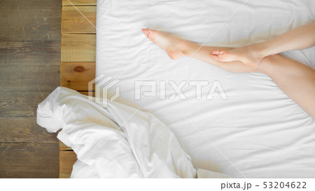 beautiful leg of a woman on white sheets beautiful leg of a woman on white sheets 53204622