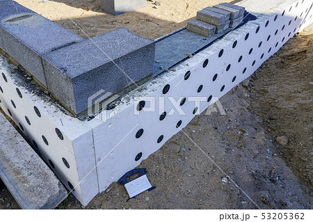 Concrete foundation of a new house, view of construction site in preparation process 53205362