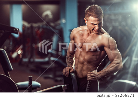 Strong Bodybuilder Doing Heavy Weight Exercise For Back On Machine Strong Bodybuilder Doing Heavy Weight Exercise For Back On Machine 53206571