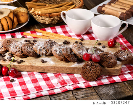 Oatmeal chocolate cookies with coffee grains and cherry. Sun flare 53207247