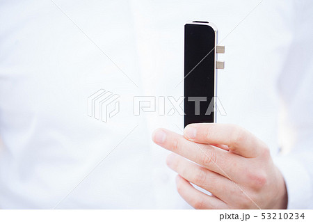 Man holding mini adapter for laptops and flash memory Man holding mini adapter for laptops and flash memory 53210234