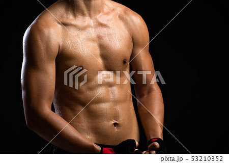Closeup of a strength fitness body with dumbbell. Closeup of a strength fitness body with dumbbell. 53210352