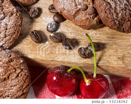 Oatmeal chocolate cookies with coffee grains and cherry. Sun flare 53218262