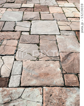 Light brown ancient stone road close up.  53219039